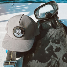 Load image into Gallery viewer, waterproof trucker hat with dive helmet logo