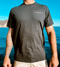 Load image into Gallery viewer, Black shirt with The Good Captain Co printed in gold

