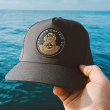 Load image into Gallery viewer, waterproof trucker hat with dive helmet logo
